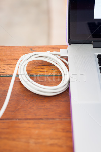 Charge battery laptop on work station Stock photo © punsayaporn