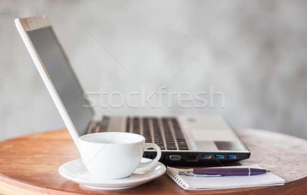 Notepad, laptop and coffee cup on wood table Stock photo © punsayaporn