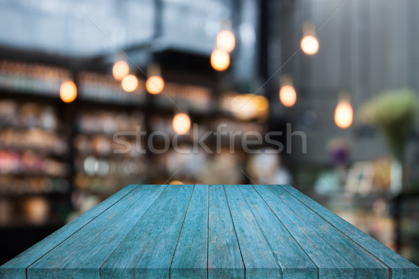 Blue table top wood with coffee shop blurred background Stock photo © punsayaporn