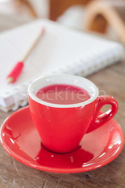 Stock photo: Red mug with open notebook