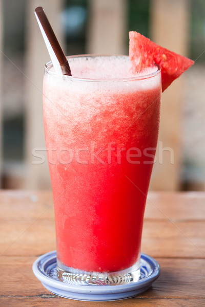 Rojo agua melón jugo de fruta mesa de madera frutas Foto stock © punsayaporn