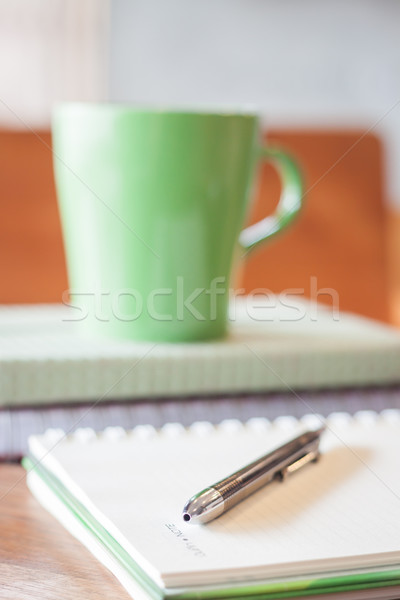 Stock photo: Closeup pen on green mug background