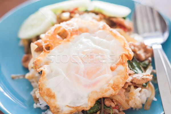 Basil fried rice with pork and fried egg Stock photo © punsayaporn