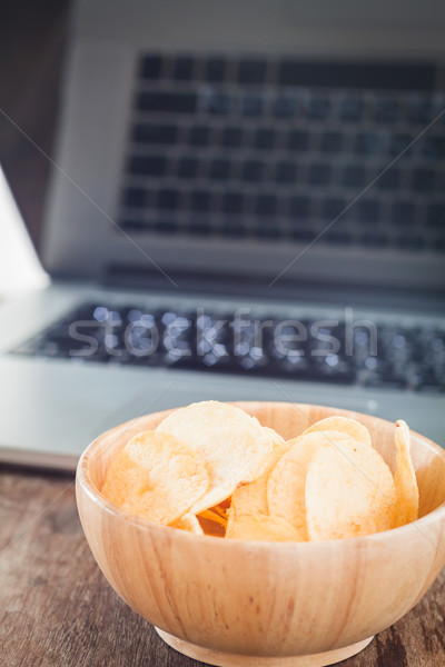 Stock photo: Crispy potato chips on wotk station