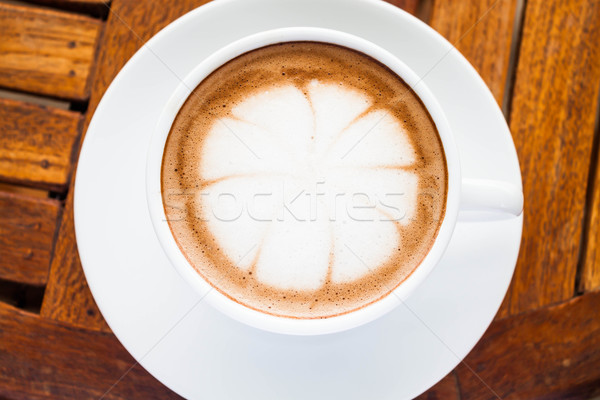 Beautiful cup of hot cafe mocha on wooden table Stock photo © punsayaporn