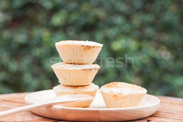 Stock photo: Mini pies on wooden plate