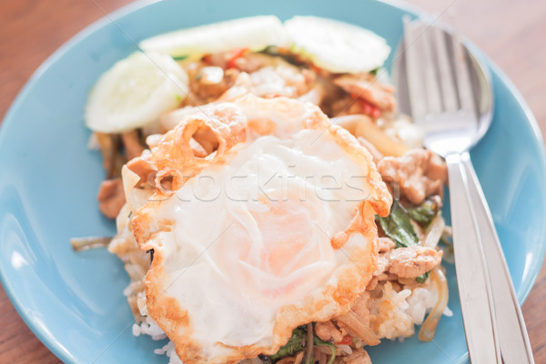 Basil fried rice with pork and fried egg Stock photo © punsayaporn