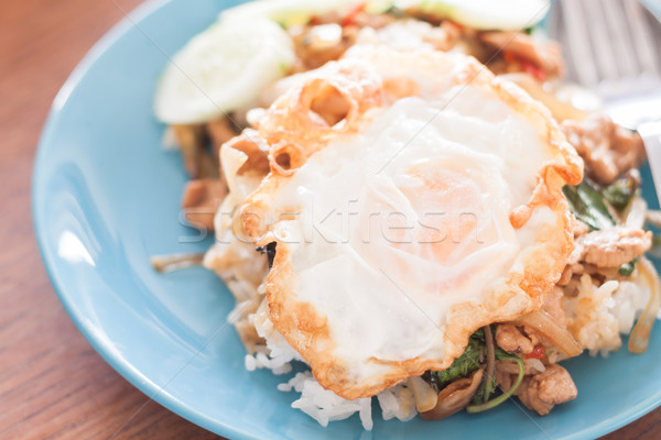 Basil fried rice with pork and fried egg Stock photo © punsayaporn