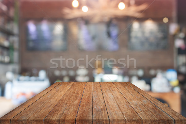 Brown table top with blurred cafe Stock photo © punsayaporn