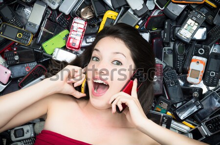 Woman on top of a Pile of mobile cell phones Stock photo © pxhidalgo