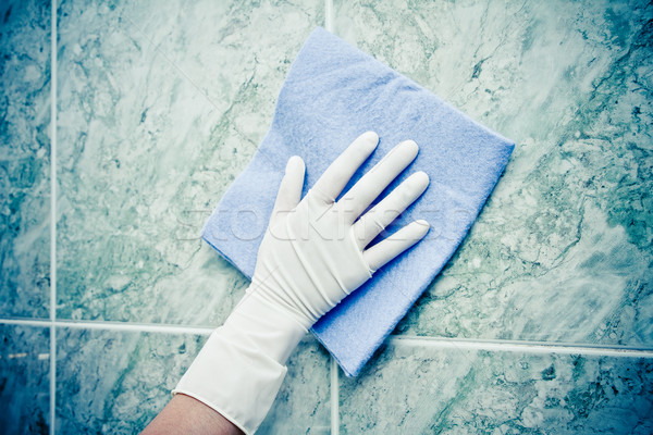 female hand cleaning kitchen tiles with sponge Stock photo © pxhidalgo