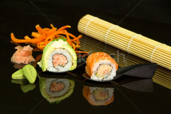 Stock photo: sushi over black background