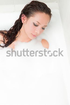 woman blowing bubbles of foam bath in the tub Stock photo © pxhidalgo