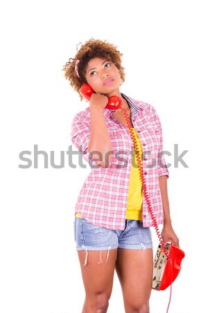 Afro-American young woman answering a call, isolated on white background Stock photo © pxhidalgo