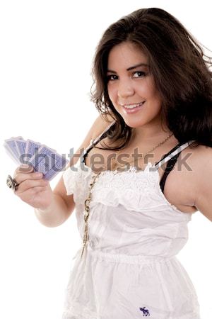 Young woman holding a hand of cards Stock photo © pxhidalgo