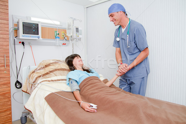 Suergeon talking to a patient in examination room Stock photo © pxhidalgo