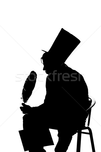 silhouette man sitting on a stool while writing Stock photo © pxhidalgo