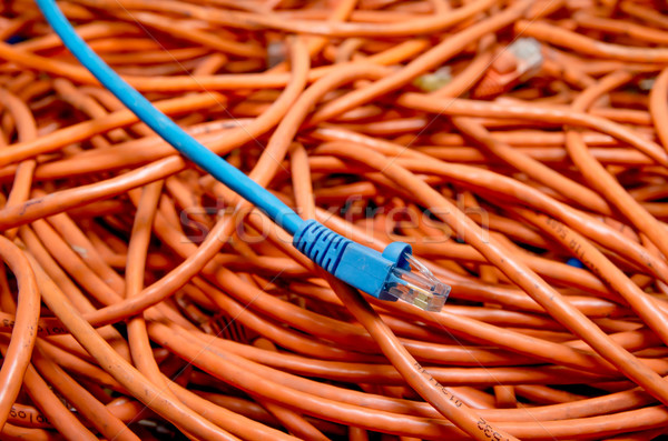 Stock photo: ethernet cables tangled blue and orange