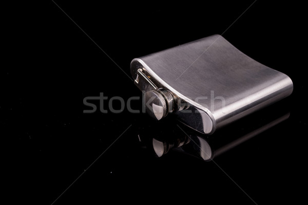 Hip flask on black background. Stock photo © pxhidalgo