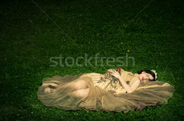 SLEEPING BEAUTY lying on the forrest with a rose Stock photo © pxhidalgo