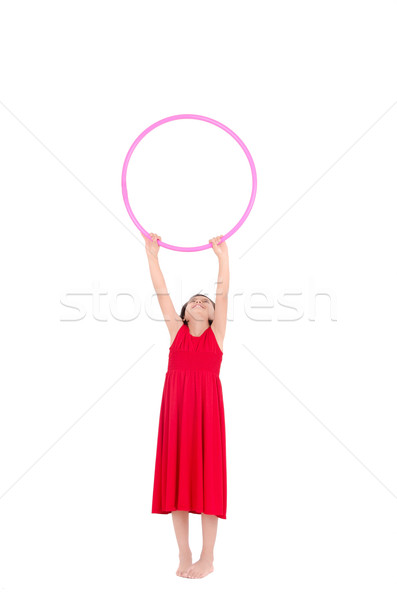 Young girl playing with hula hoop isolated over white background Stock photo © pxhidalgo