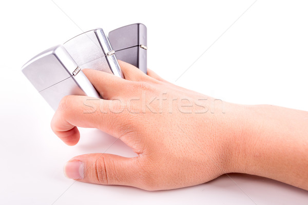 hand holding metal lighters isolated on white background Stock photo © pxhidalgo