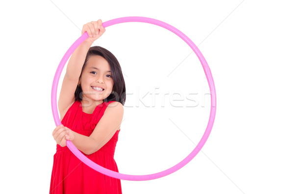 Young girl playing with hula hoop isolated over white background Stock photo © pxhidalgo