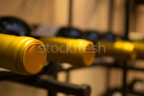 Wine bottles stacked on racks Stock photo © pxhidalgo