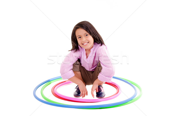 Young girl playing with hula hoop isolated over white background Stock photo © pxhidalgo