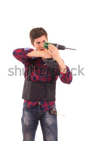 Stock photo: woman in suit and sunglasses holding a gun