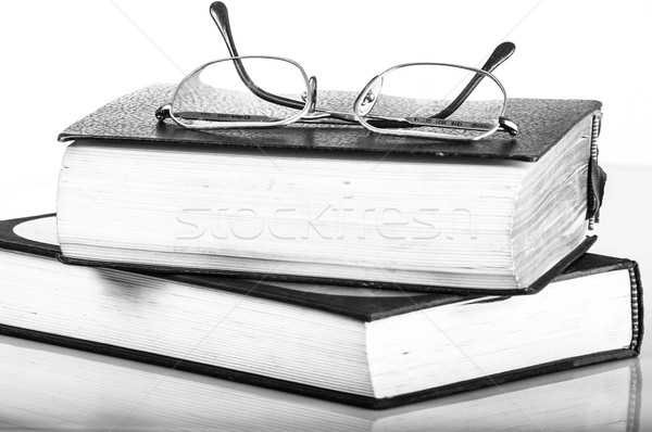 Stock photo: a pile of books and glasses