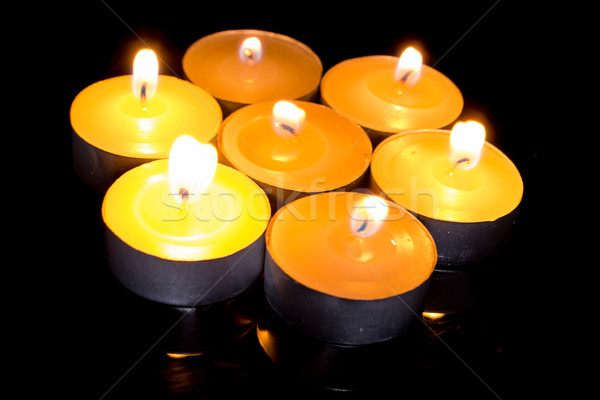 Group of burning candles on  black background. Stock photo © pxhidalgo