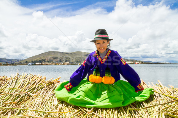 Stock photo: Sitting girl on a floating Uros island, Titicaca