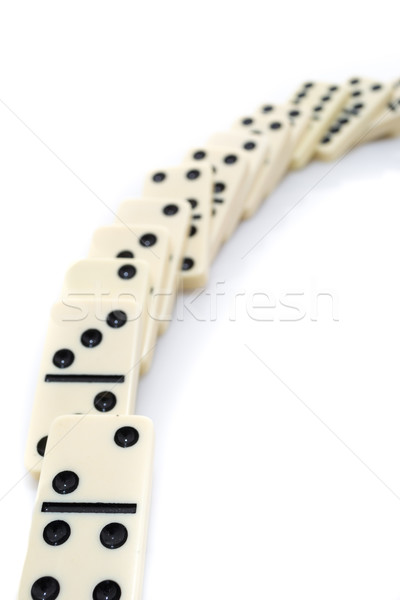 Fallen dominoes over white background Stock photo © pxhidalgo
