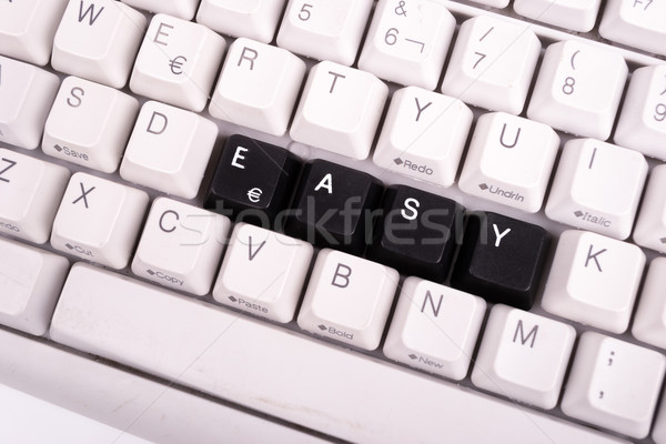 Word Easy written with black keys on computer keyboard. Stock photo © pxhidalgo