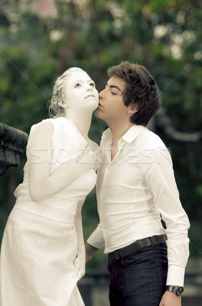 Young male KISSING at a female MODEL statue Stock photo © pxhidalgo