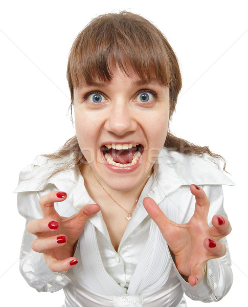 Scared amusing young woman shouts Stock photo © pzaxe