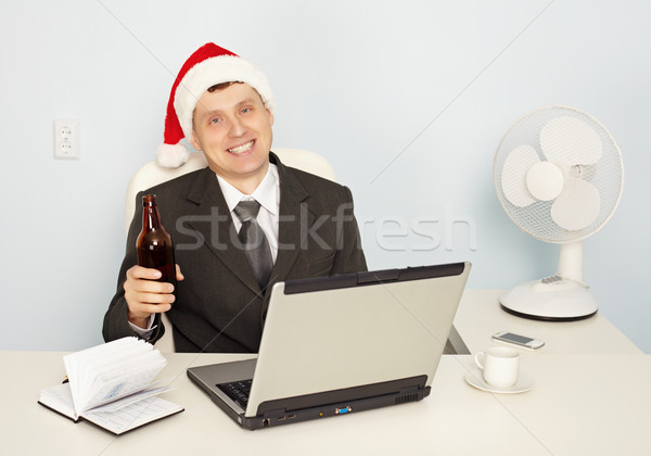 Businessman gets drunk at office before new year Stock photo © pzaxe