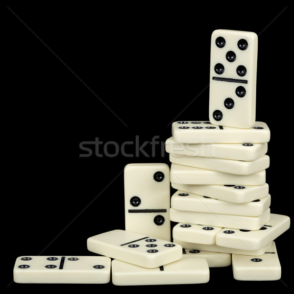 Pile of dominoes isolated on black background Stock photo © pzaxe