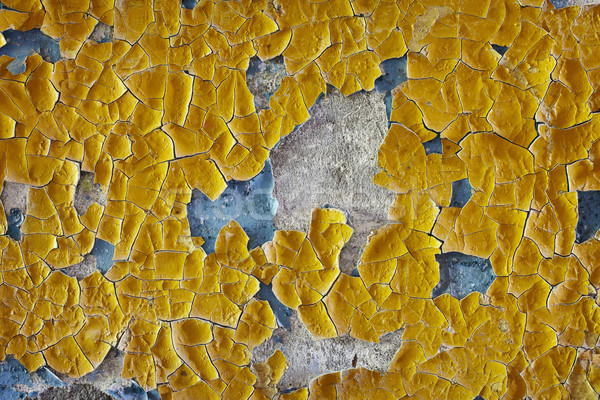 Cracked oil enamel on an old wall - background Stock photo © pzaxe