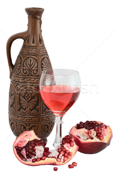 Glass of wine, bottle and a red pomegranate Stock photo © pzaxe