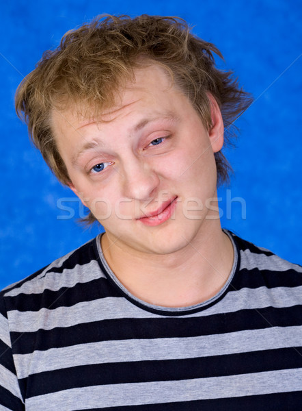 Young man with dishevelled hair Stock photo © pzaxe