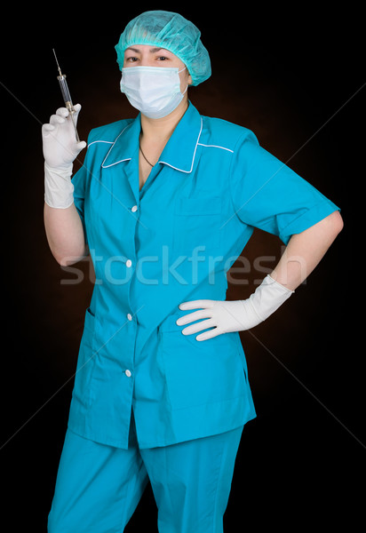 Enfermera jeringa mano retrato médico trabajo Foto stock © pzaxe