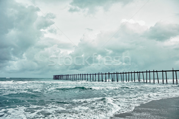 Old jetty over the stormy sea Stock photo © pzaxe