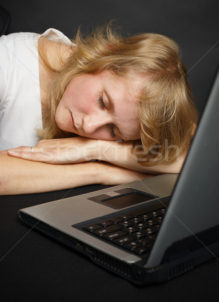 Woman asleep at table near computer Stock photo © pzaxe