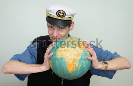 Woman in sea uniform and globe Stock photo © pzaxe