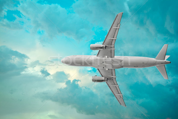Passenger airplane in the beautiful cumulus clouds Stock photo © pzaxe