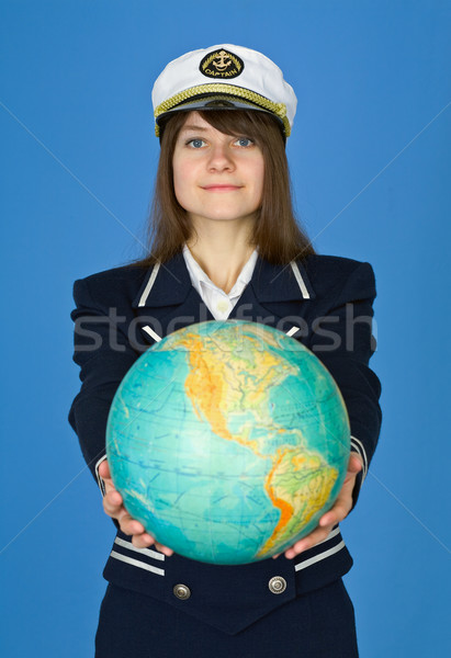 Girl in sea uniform with globe Stock photo © pzaxe