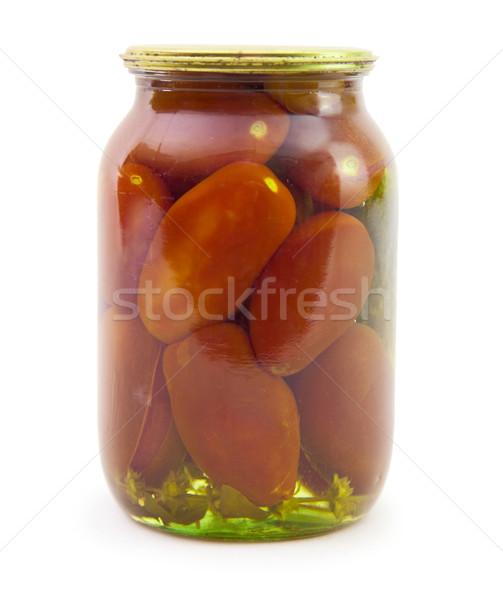 Marinated tomatoes in glass jar isolated on white background Stock photo © pzaxe