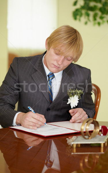 Groom solemnly signed documents Stock photo © pzaxe